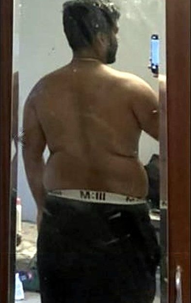 Client from behind before coaching, 106.4 kg